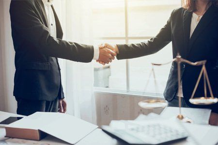 Businessman Shaking Hands — Pittsfield, MA — Drennan Law Offices