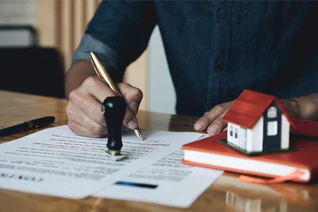 Attorney Signing the Paper — Pittsfield, MA — Drennan Law Offices