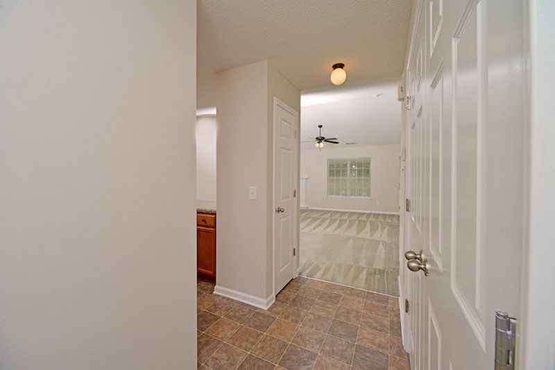 beacon main entry hallway- view of kitchen, dining room, and living room to the left. Laundry room area to the right. 