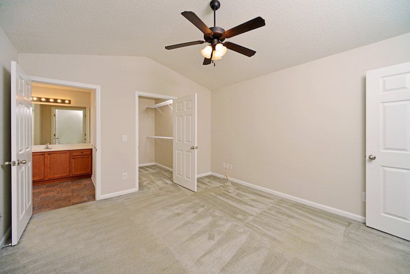 beacon master bedroom with view of bathroom and walk-in closet