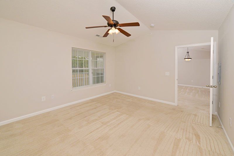 Beacon Master bedroom view from the walk-in: you can see the window to the left with the cathedral ceilings and ceiling fan. 