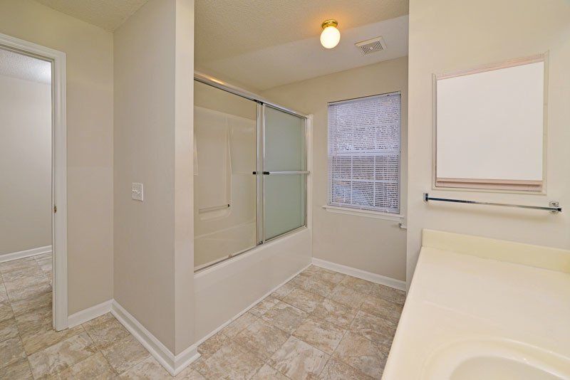 crest- bathroom view of shower and window