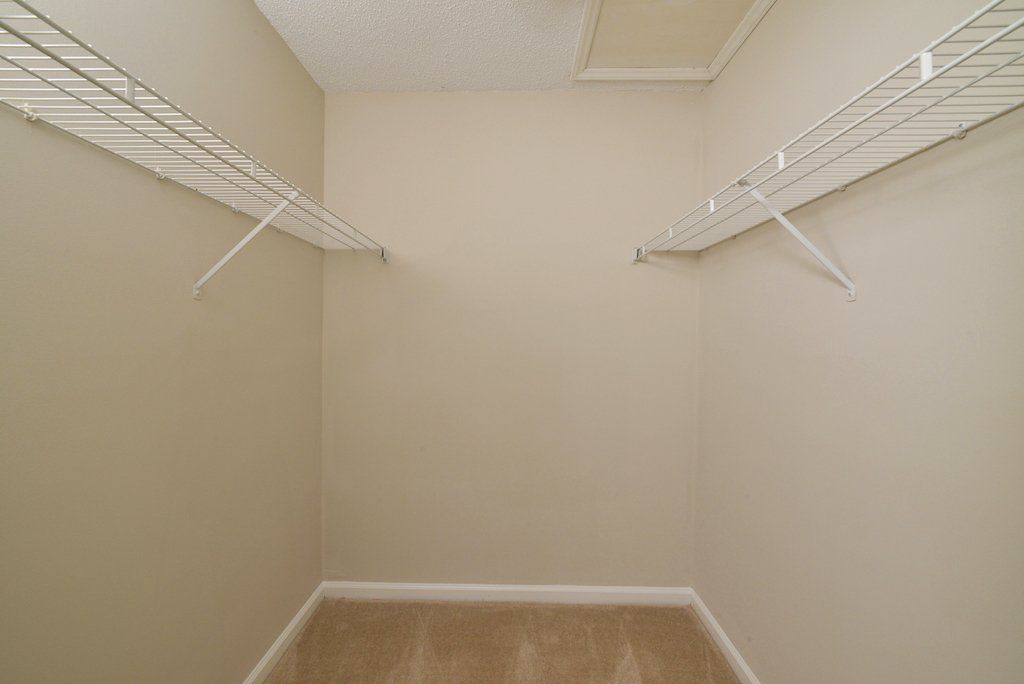 Summits master bedroom walk-in closet. Racks on both sides to the right & left