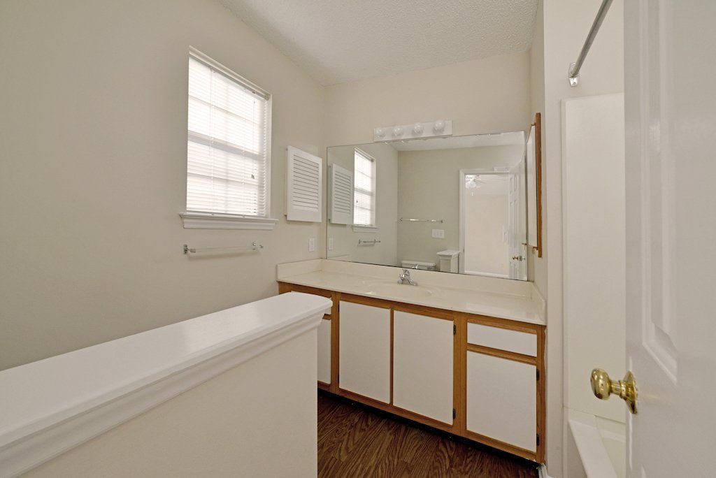 Summits master bathrooms bathroom- view of the kitchen sink and the 3ft wall that separates the toilet from the walkway