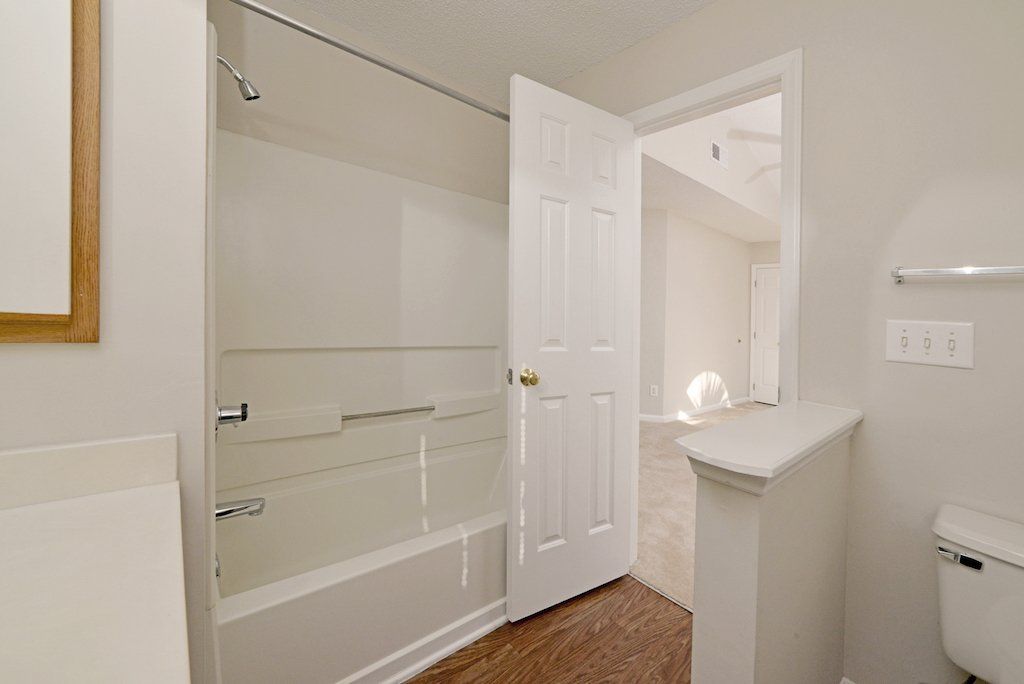 Summits master bathrooms bathroom- view of the tub and the 3ft wall that separates the toilet from the walkway