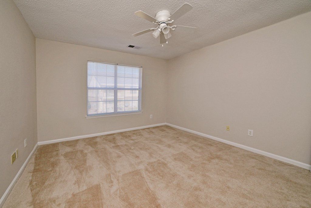 Summits guest bedroom- view with window from corner
