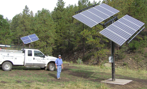Filtration — Man Holding A Paper Near The Water Station in Weston, CO