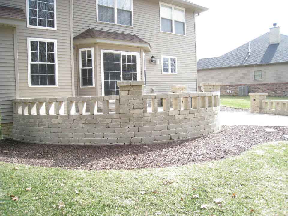 Nice outside bricking installed around back of house in Mapleton, IL - Beal Landscaping