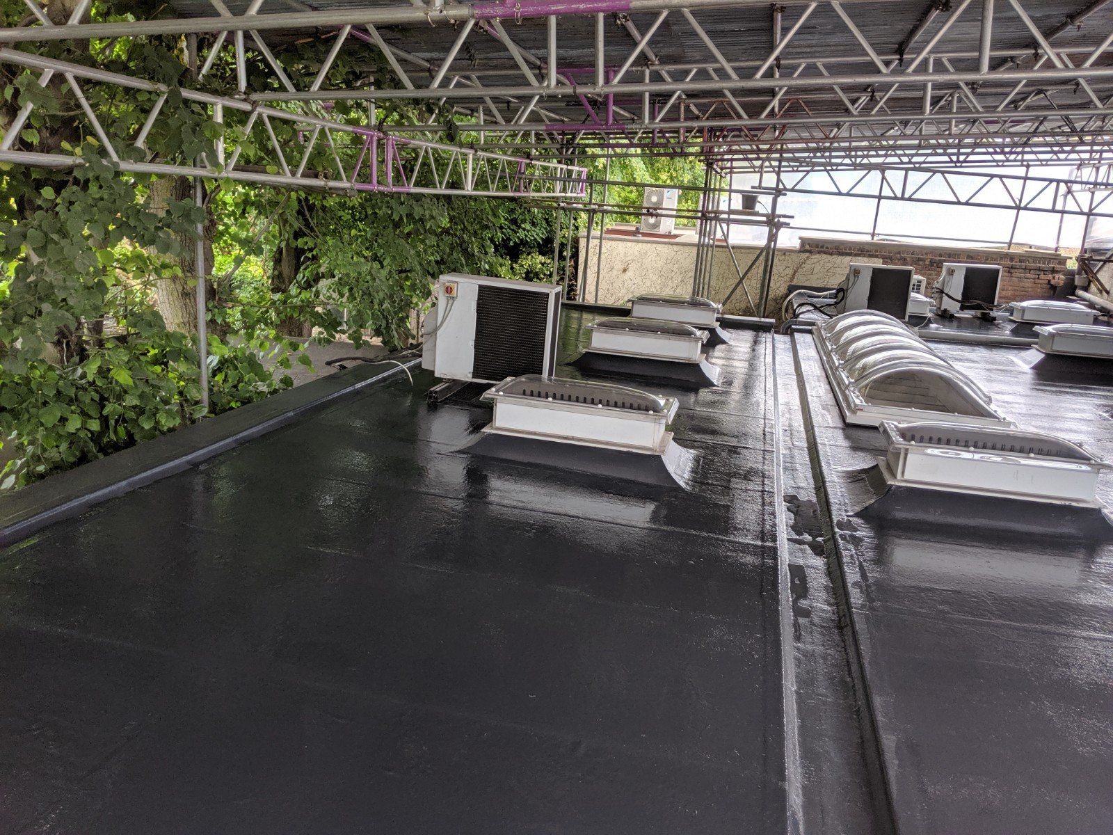 The roof of a building with a lot of vents on it.