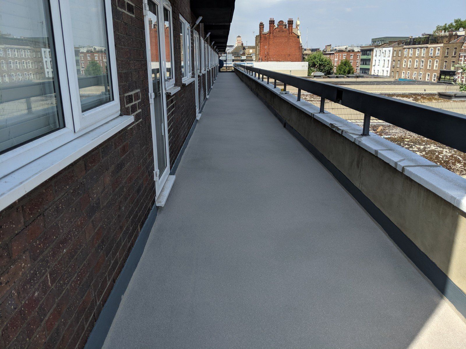 A brick building with a walkway leading to it