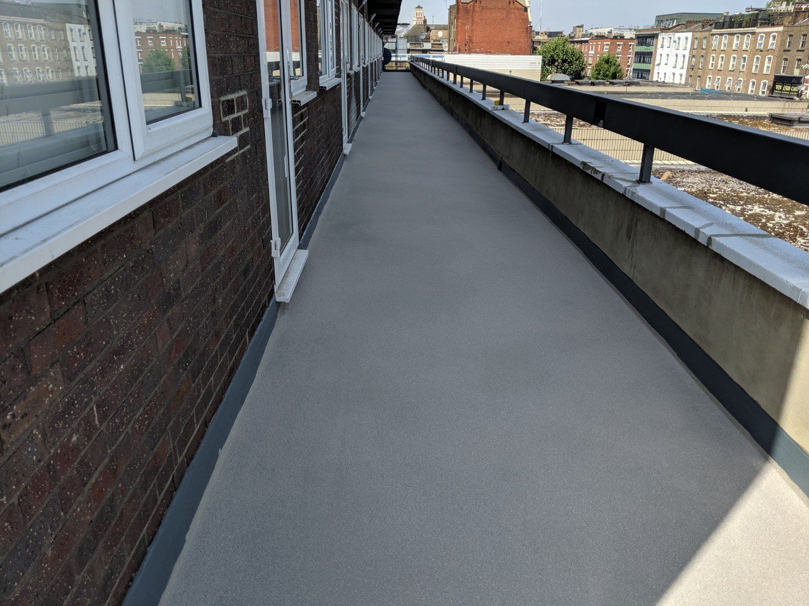 A brick building with a walkway leading to it