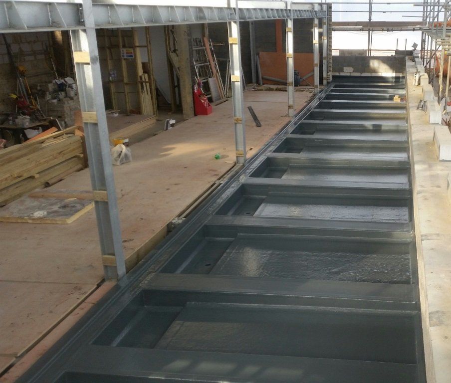A building under construction with a staircase in the middle