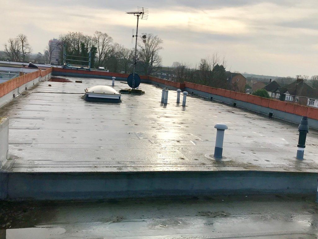 The roof of a building with a skylight on it