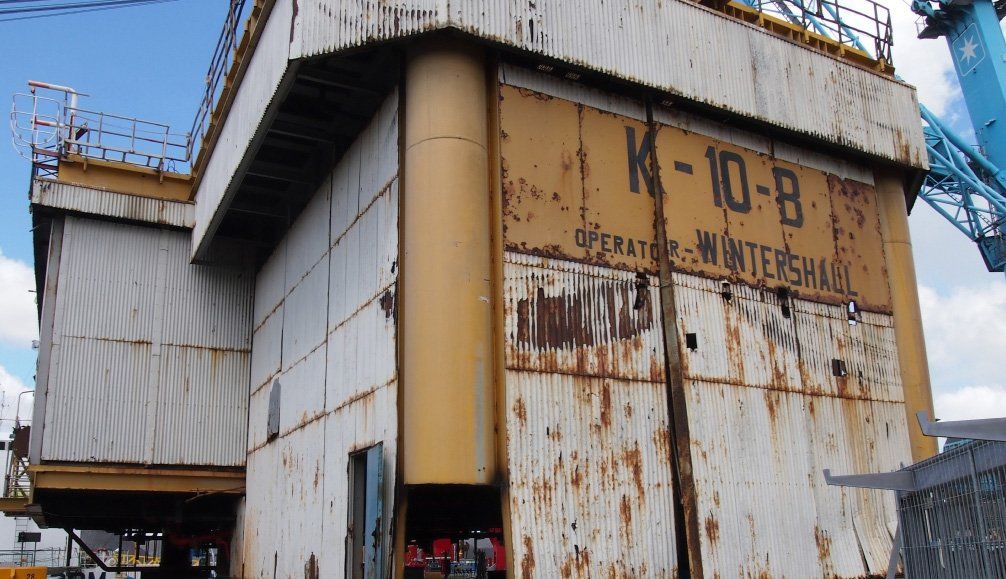 Rusting industrial structure labeled 