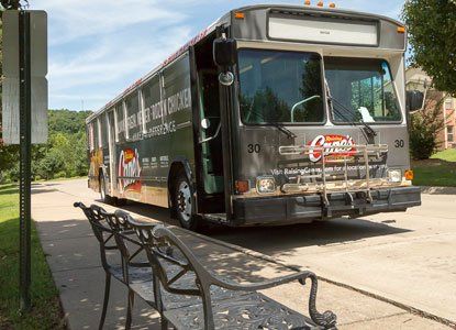full bus wrap stopping at bus stop