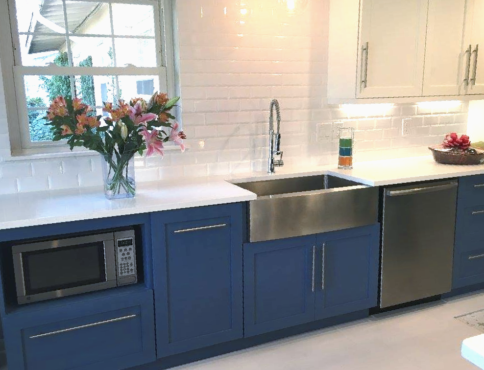 Modern kitchen remodel with white shaker cabinets and granite countertops