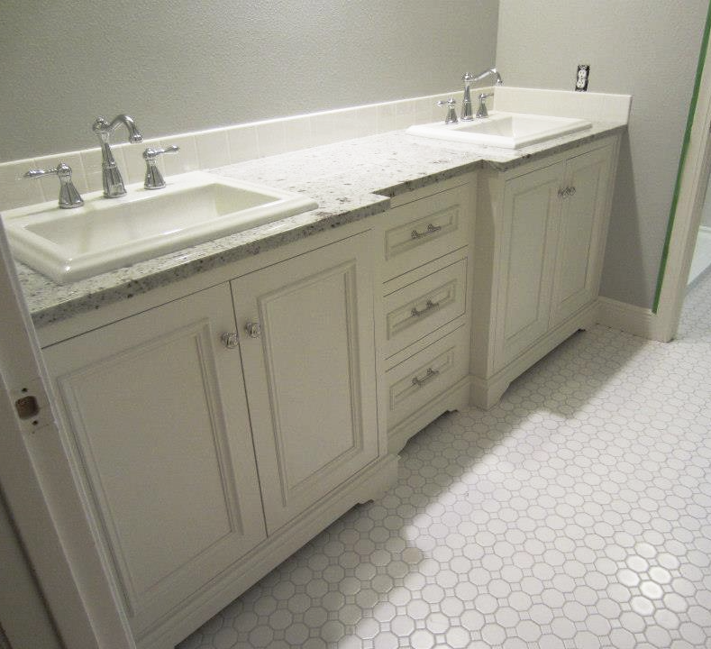 Custom-built bathroom vanity with double sink and wood finish