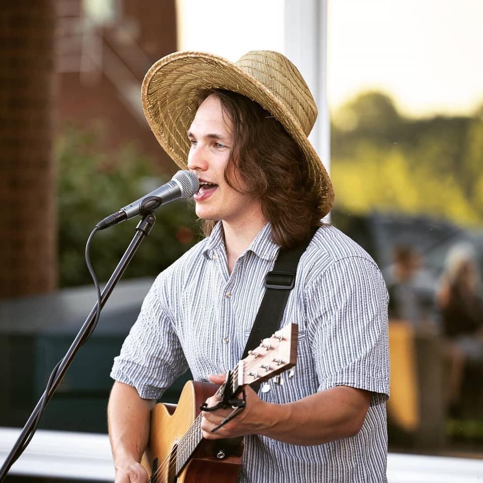 guy with guitar singing