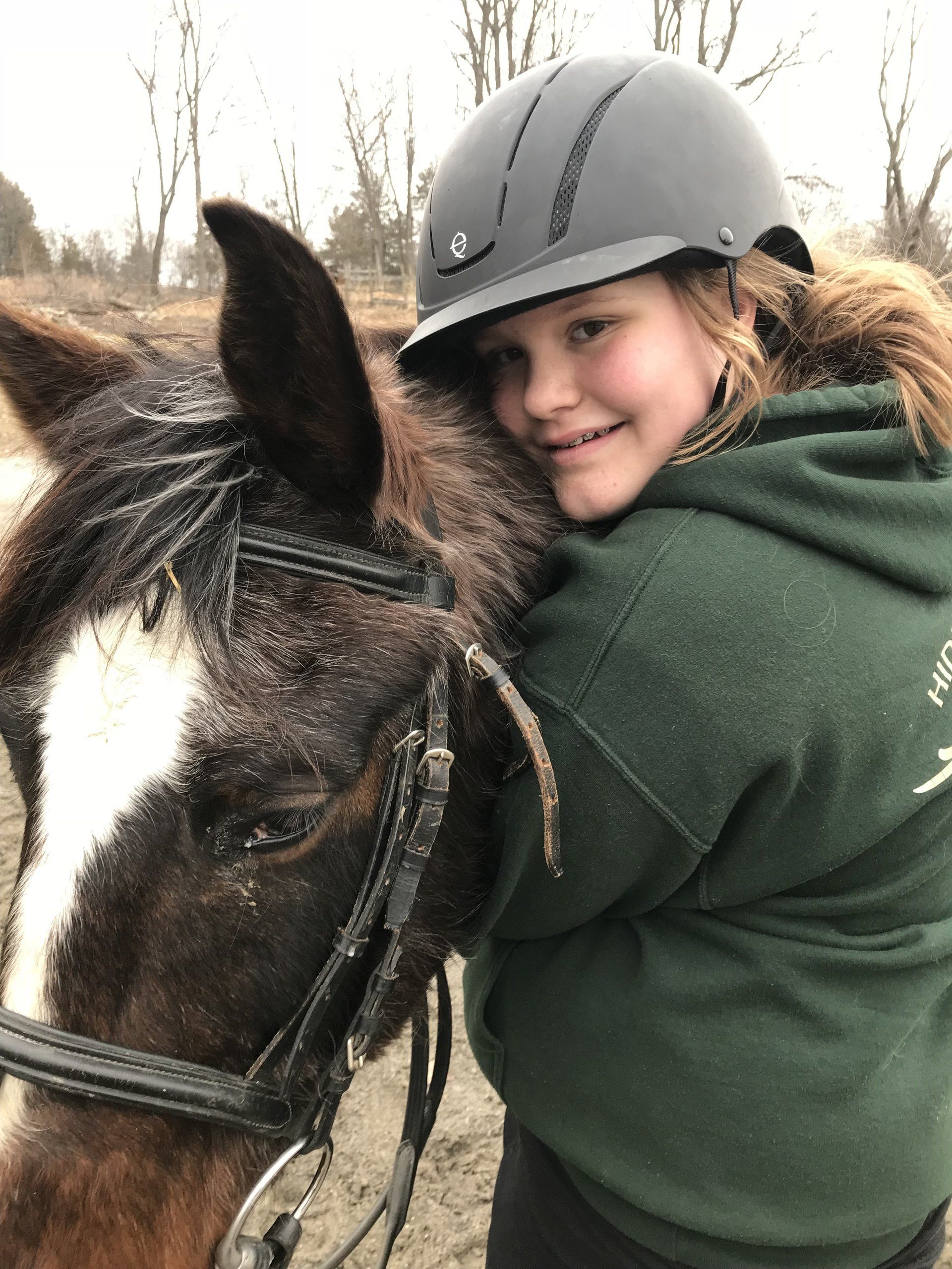 Photo: Aliana hugging horse