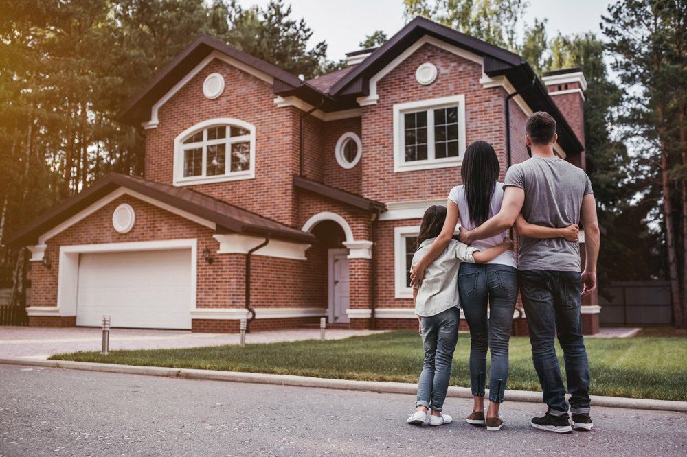 Family Outside House — Woodsfield, OH — Francis J Paulus Insurance Agency
