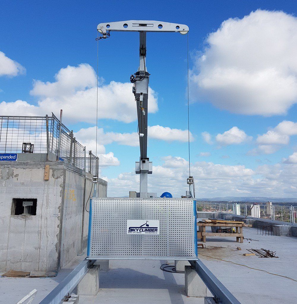 a close up of a Sky Climber BMU platform on a building