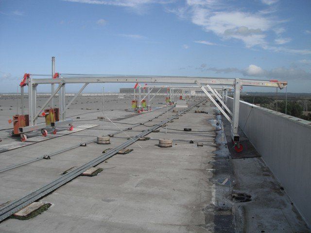 Mobile suspended access cradle rig on car park roof