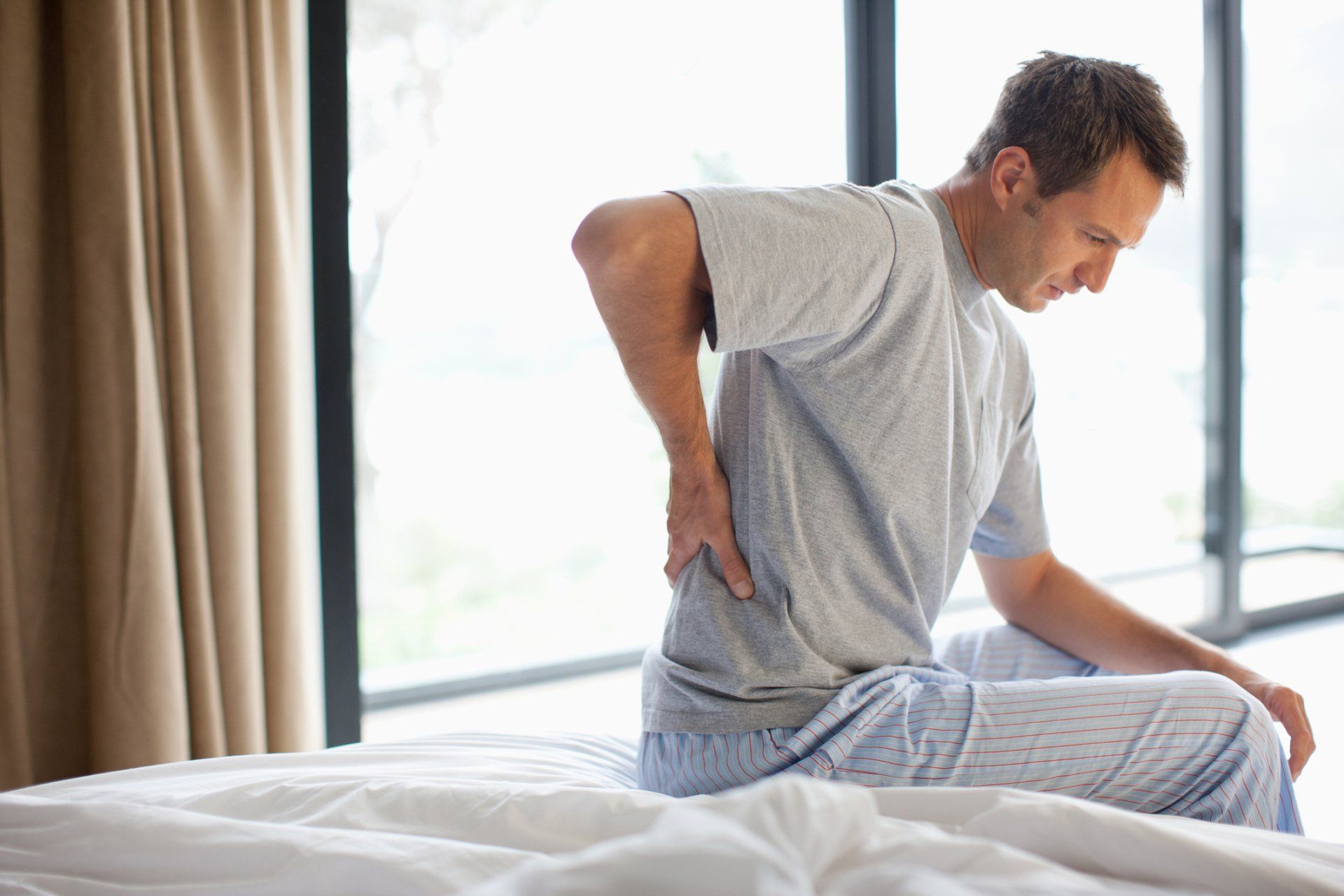 Man Having Back Pain | Coastal Neurology, Inc. | Daytona Beach