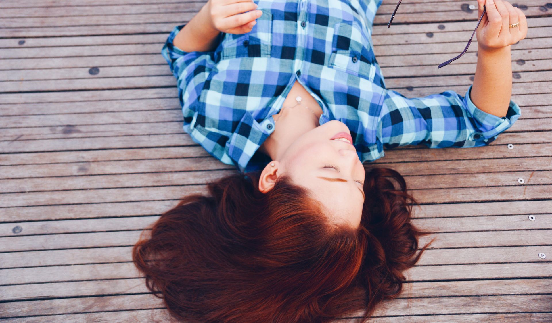Woman in a deck by Aki Tolentino on unsplash.com for Decks N Pergolas