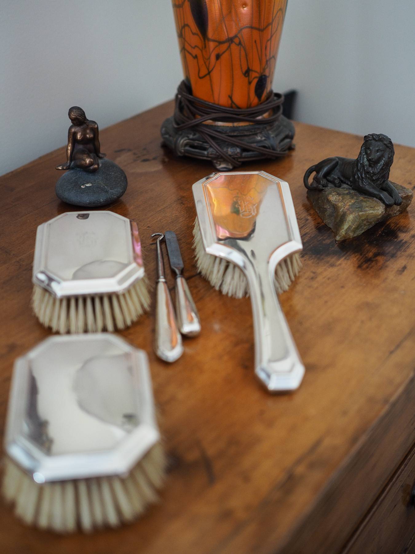 fancy mirror brushes on a wooden table