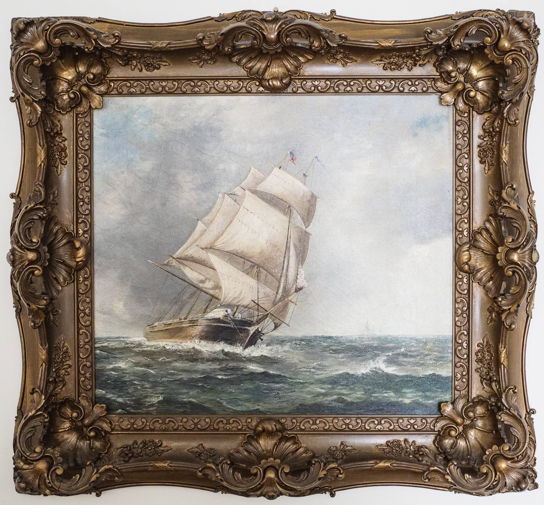 painting of a ship in a fancy gold frame