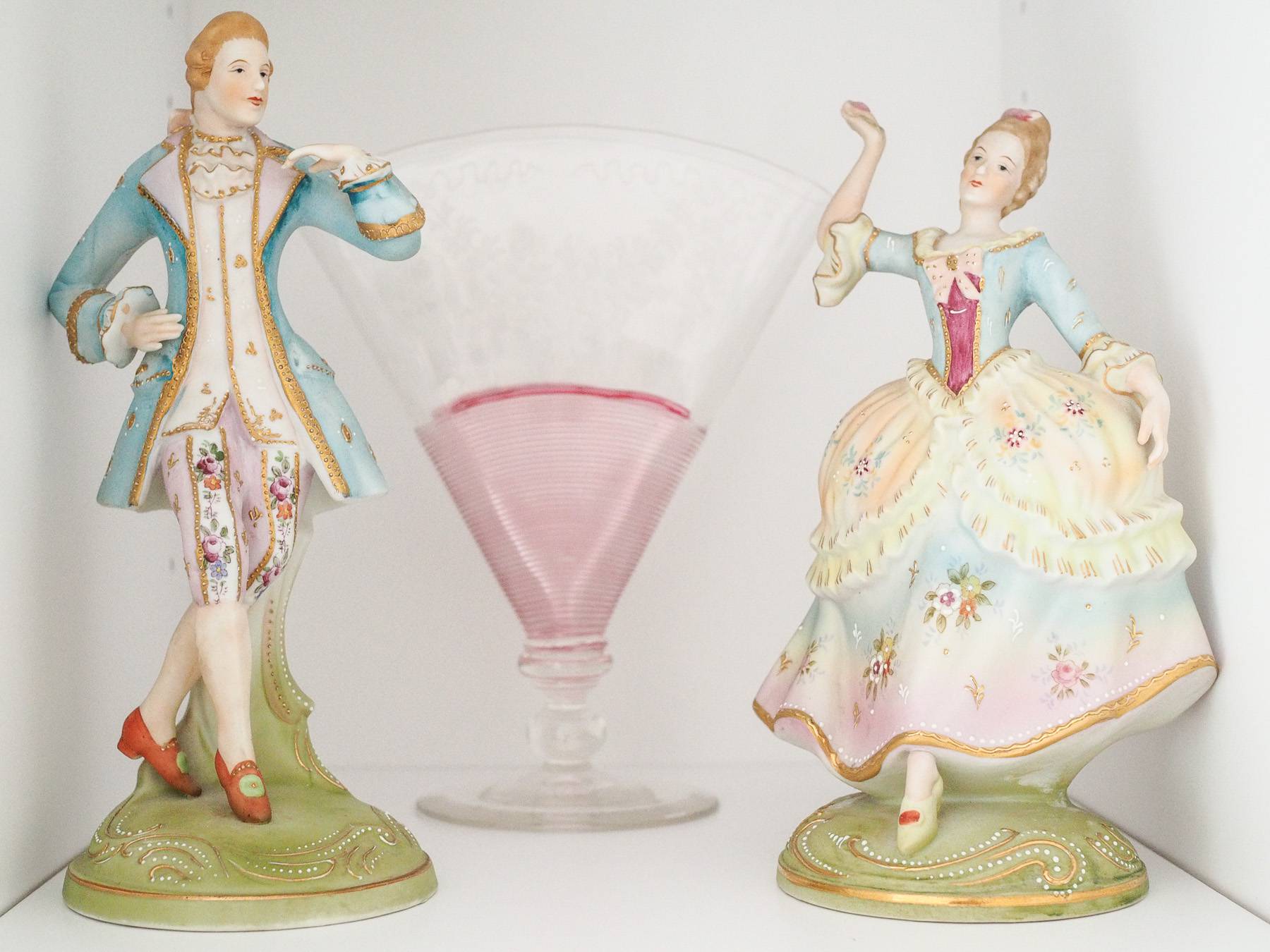 glass decorative man and woman statues