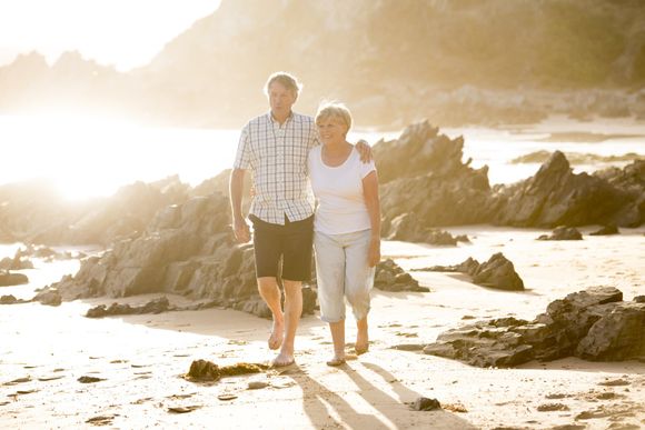 couple walking on beach San Diego funeral home
