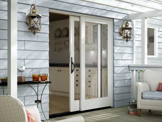 A sliding glass door is open to a living room
