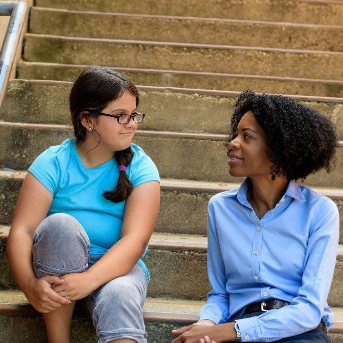 CASA volunteer helping child