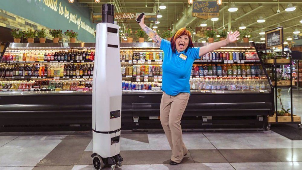 Robots are now showing customers where to find products Superstores are using robots to guide customers