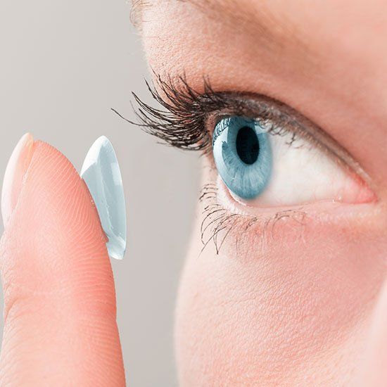 Woman Putting Contact Lenses — Defiance, OH — Professional Vision Services, LLC