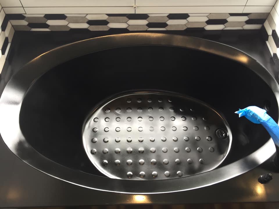 A stainless steel sink with holes in it