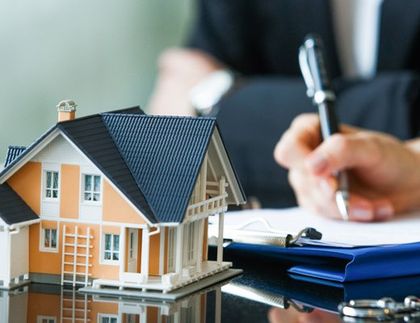 Home Insurance — A Miniature House with Insurance Agent at the back In Mcalester, OK Home Insurance — A Miniature House with Insurance Agent at the back In Mcalester, OK