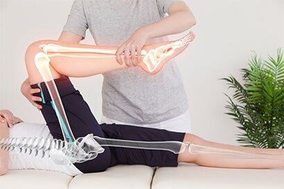 A woman receiving chiropractic services near Goodrich, MI