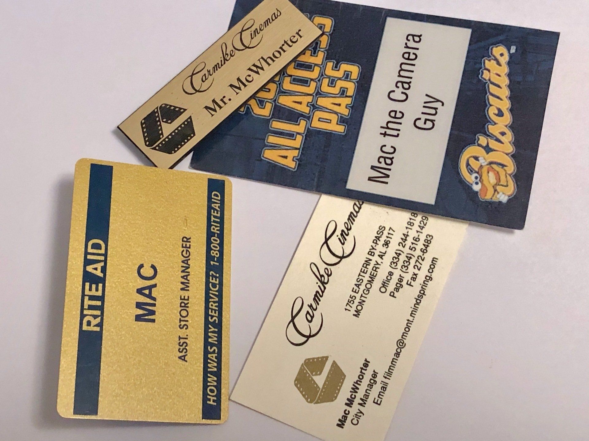 Several business cards including rite aid mac and mac the camera guy