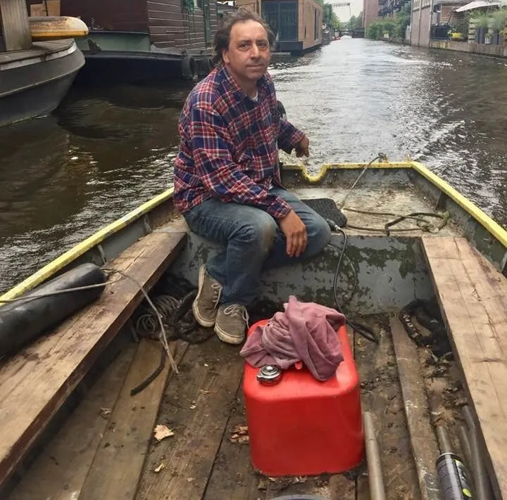 Steve Basuino taking a boat back to his yard for repairs