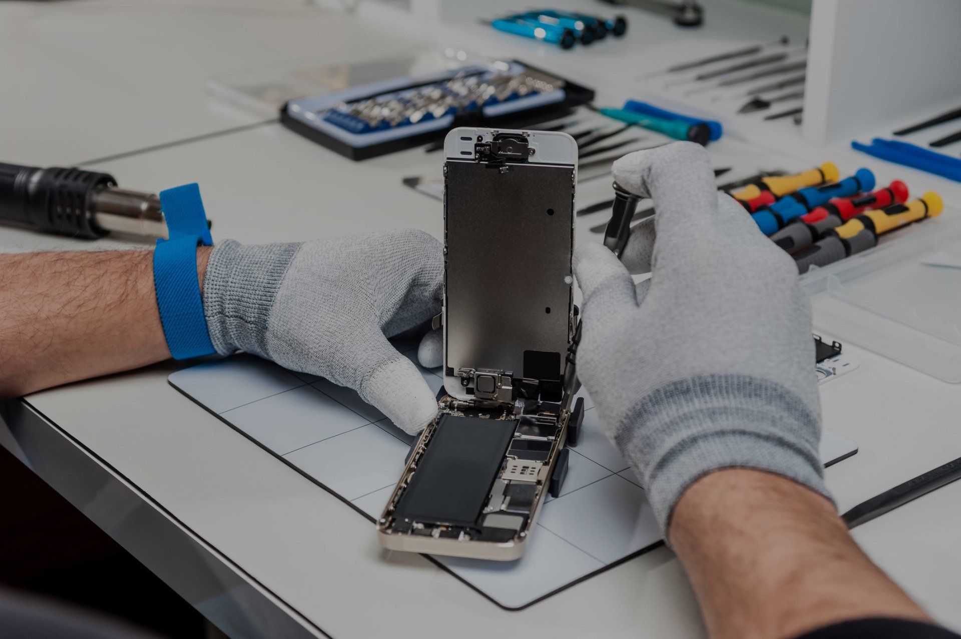 Technician Repairing a Phone — Sioux City, IA — Computer SOS