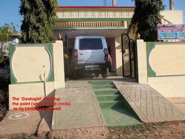 A white van is parked in front of a house