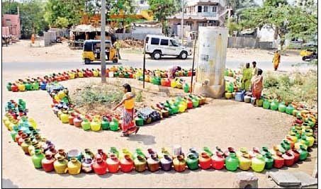 A bunch of colorful pots are arranged in the shape of a snake