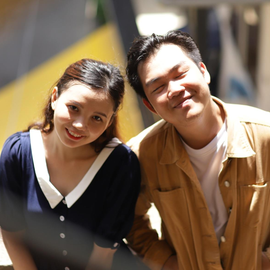 A man and a woman are posing for a picture together