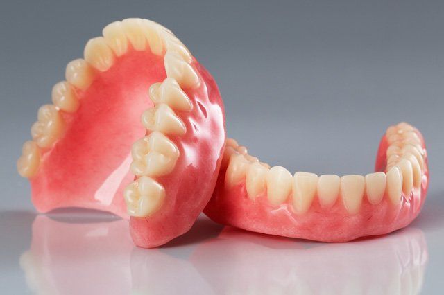 dentures dentures on grey backdrop