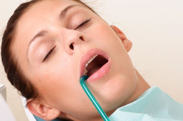 under anaesthesia female patient under anaesthesia at dentist