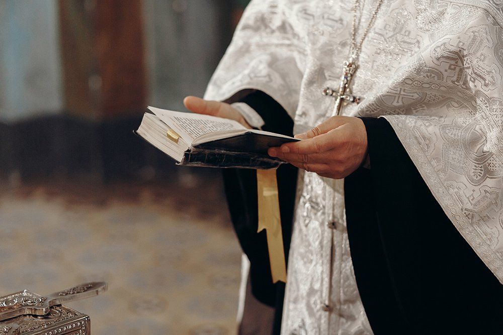 Priest Reading Holy Bible — Saint John, IN — Boric Religious Gift