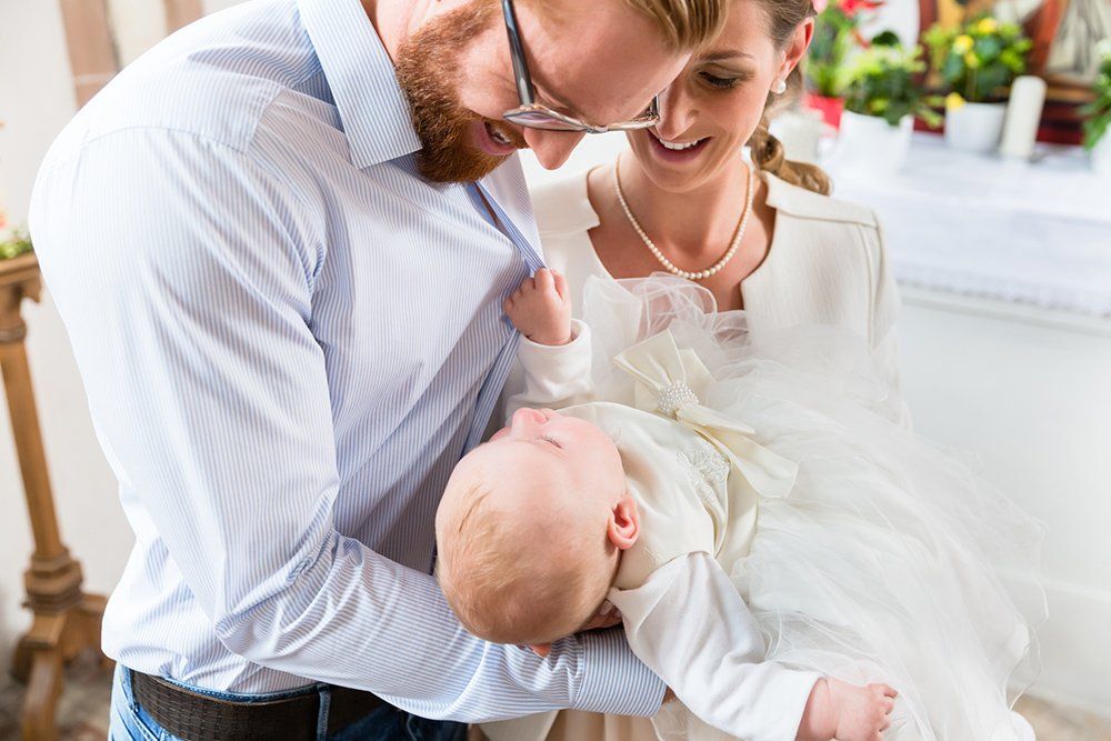 Parents with Baby at Christening — Saint John, IN — Boric Religious Gift