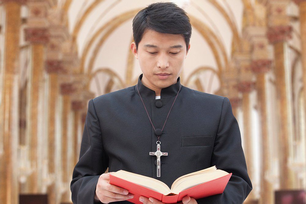 Priest Holding A Bible Book — Saint John, IN — Boric Religious Gift Priest Holding A Bible Book — Saint John, IN — Boric Religious Gift